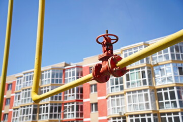 Almaty, Kazakhstan - 08.29.2025 : A gas pipe on the background of multi-storey residential...