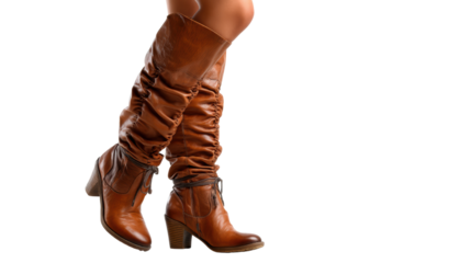 Stylish brown knee-high boots with a slouch design on a white isolated background.