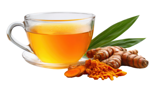 Turmeric tea in a glass cup with fresh turmeric roots and leaves, on a white isolated background.