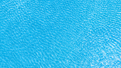 Top view beach sand background for summer vacation concept. Beach nature and summer seawater with sunlight light sandy beach Sparkling sea water 