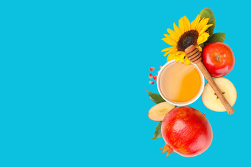Bright fruits honey and sunflower are arranged on a blue background