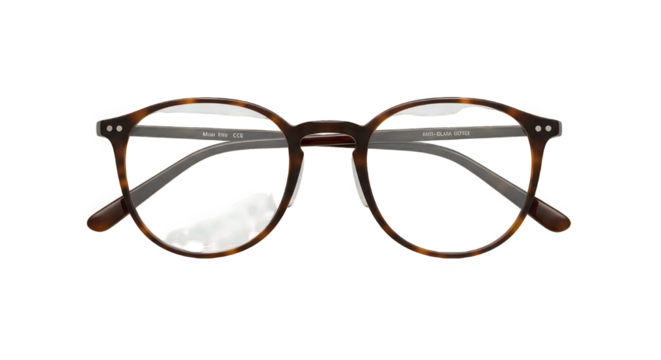 Close up of tortoise shell eyeglasses with clear lenses on a black background in studio light
