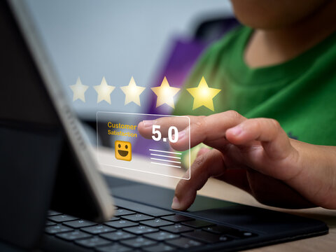 Child using tablet with virtual 5 star rating interface, representing kids and technology, online reviews, customer satisfaction, digital feedback, gamification learning, and interactive experience.