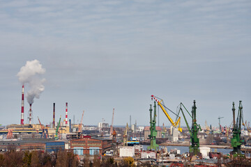 Panoramic view of shipyard with port cranes, industrial buildings and harbor infrastructure