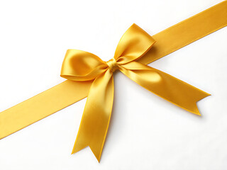 Fototapeta premium A shiny golden ribbon tied in a bow diagonally across a white surface with a smooth and elegant appearance