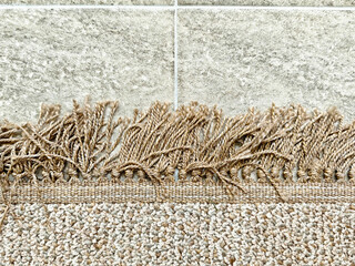 Textured carpet edge and tiled flooring provide contrast and depth for interior design ideas and...