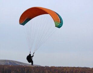 Paraglider Flight Over Hills
