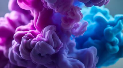Fototapeta premium Vibrant purple and blue ink clouds swirling in water