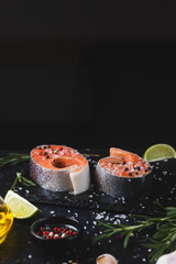Raw trout steaks with seasonings