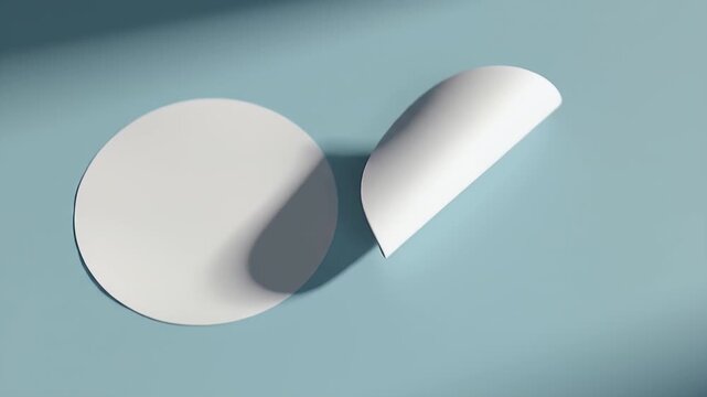 Two White Circular Stickers on a Light Blue Background