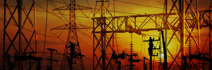 silhouette electric worker work late on electric pole connect the line from high voltage power supply and station