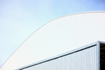 architecture design square shape corrugated wall geometric buiding. The factory warehouse is exterior decorated with corrugated texture to create a point of interest with beautyl