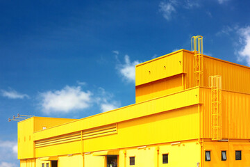 architecture design square shape corrugated wall geometric buiding. The factory warehouse is exterior decorated with corrugated texture to create a point of interest with beautyl