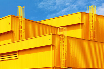 architecture design square shape corrugated wall geometric buiding. The factory warehouse is exterior decorated with corrugated texture to create a point of interest with beautyl