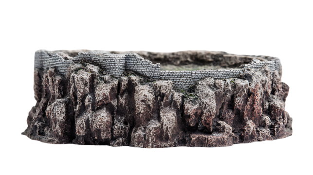 Miniature castle ruin on a rocky cliff isolated on transparent background