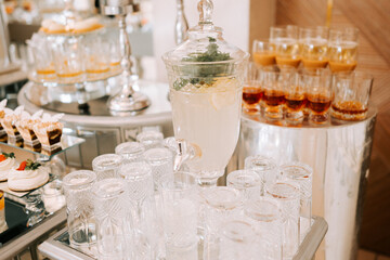 Refreshing beverage station with elegant glassware at a modern event in the afternoon