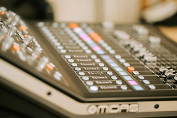 Control surface in use during music production in a studio setting