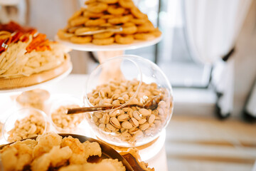 Delicious assortment of snacks displayed at a festive gathering in a bright indoor setting