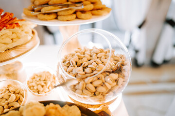 Delicious variety of snacks displayed at a daytime event featuring nut selection