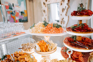 Elegant food display featuring assorted appetizers at a gathering in a modern setting