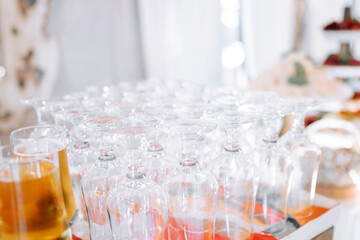 Elegant glassware arranged on a colorful table setting at a festive gathering