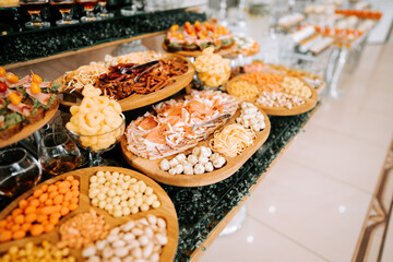 Elegant buffet spread featuring a variety of appetizers and snacks at a festive event