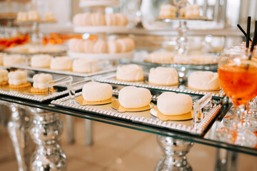 Sweet dessert table featuring elegant pastries and refreshments at a celebration