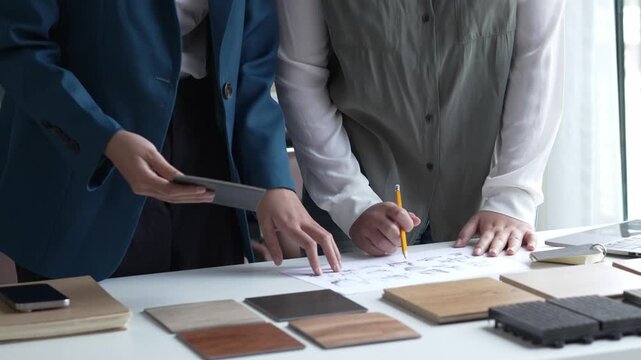 Two Interior Designers Collaborating in Office