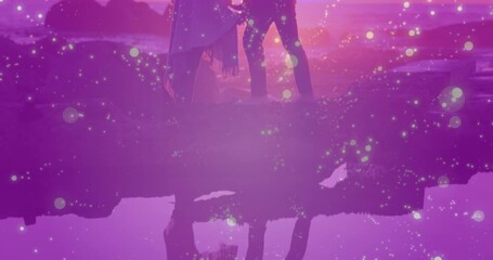 Animation of glowing spots over diverse couple kissing - Powered by Adobe