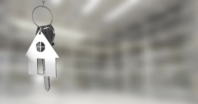 Animation of silver house keys hanging against blurred background with copy space