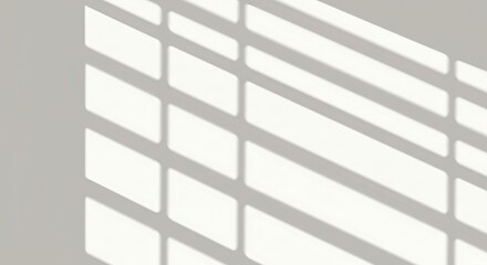 Soft shadows cast by horizontal window blinds on a light wall  