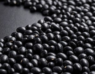 Close-up view of dark, glossy black soybeans meticulously arranged on a sleek surface, highlighting their organic form and potential as a wholesome ingredient in diverse cuisine