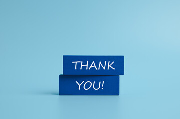 Symbol with word thank you, Wooden block and text on light blue background, Positive communication, Business and thank you concept. copy space	