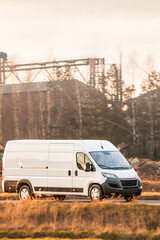 Freight transport van passing through countryside