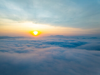 Amazing Sunrise over mountains hills covered with mist, Aerial view landscape drone shot beautiful...