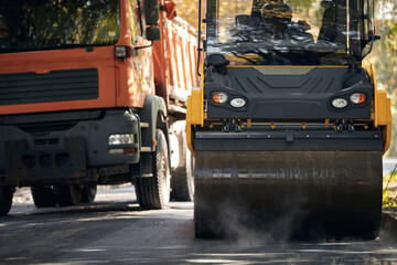 Public city street reconstruction with heavy machines.