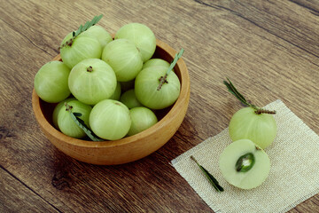 Fresh gooseberries bowl on table