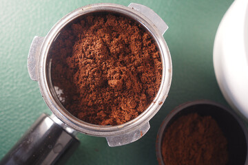 Coffee grounds prepared for brewing in a kitchen setting