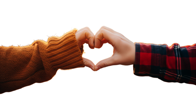  Two hands, one in a knitted orange sleeve and the other in a plaid shirt, form a heart shape with fingers, set against a blurred autumnal background with a bright orange sun.