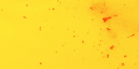 Abstract pattern with a bright yellow background and scattered red-orange splashes of varying sizes and shapes.