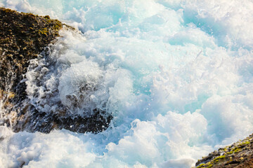 A large body of water with a lot of foam and bubbles