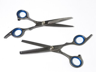Elegant steel scissors with blue accents, representing precision and professional style.