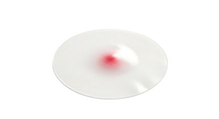 Closeup of a spinning red disc on a clear plate isolated on white background