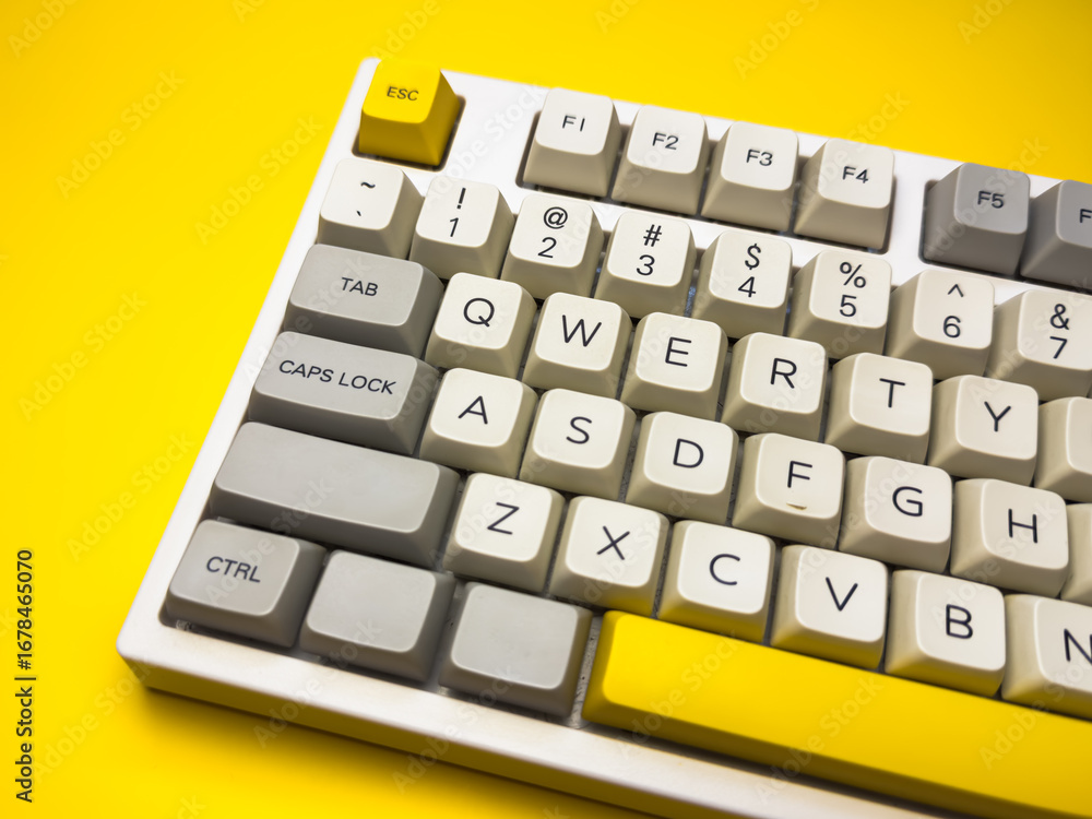 Fototapete white mechanical keyboard with bright esc key on bright yellow background, minimalism, keyboard butt
