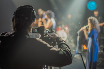 cameraman broadcasting at a music concert