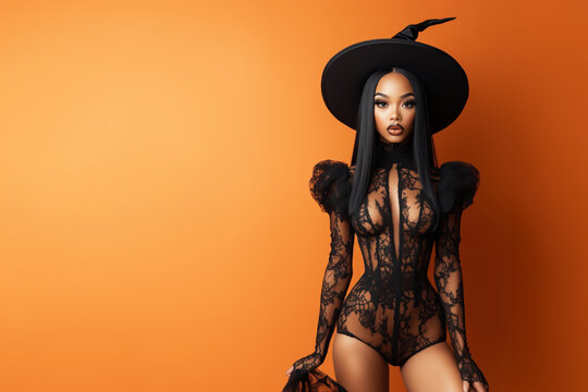 young black woman wearing witch hat and sexy lace bodysuit as halloween or fasching costume