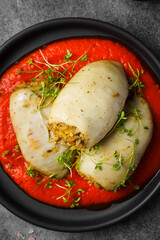 squid stuffed with rice with tomato and pepper sauce