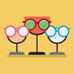 Three glasses with different colors and sizes are standing on a blue background. The glasses are arranged in a row, with the tallest one on the left, the middle one in the middle