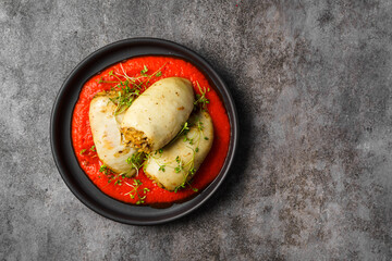 squid stuffed with rice with tomato and pepper sauce