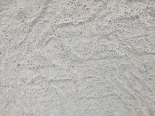 Fine Grain Sand Texture: Close-Up View of Beach Sand Surface